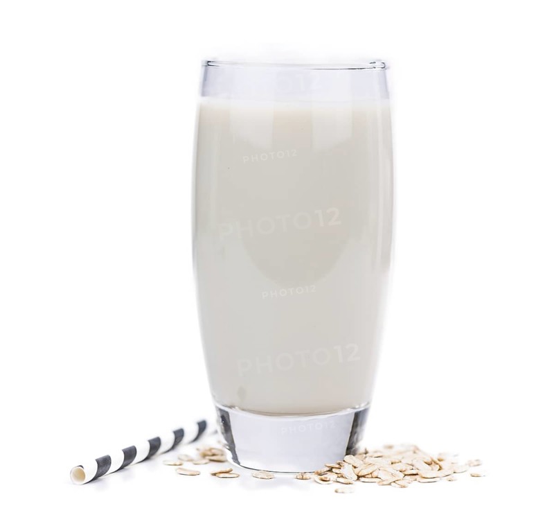 Oat Milk isolated on white background (selective focus, close-up shot)
