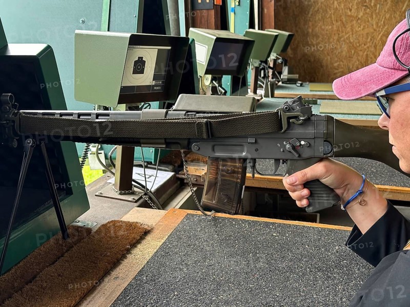 Woman Training Precision Shooting with a Military Assault Rifle in Shooting Range in Switzerland