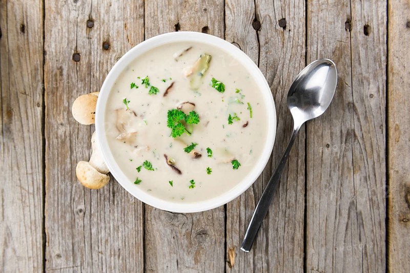 Portion of fresh Porcini Soup close-up shot, selective focus