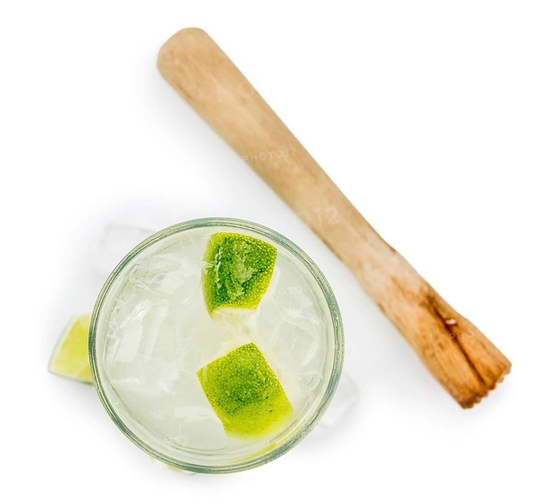 Caipirinha as detailed close-up shot isolated on white background (selective focus)