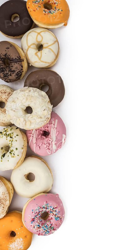Fresh made Donuts isolated on white background (selective focus)