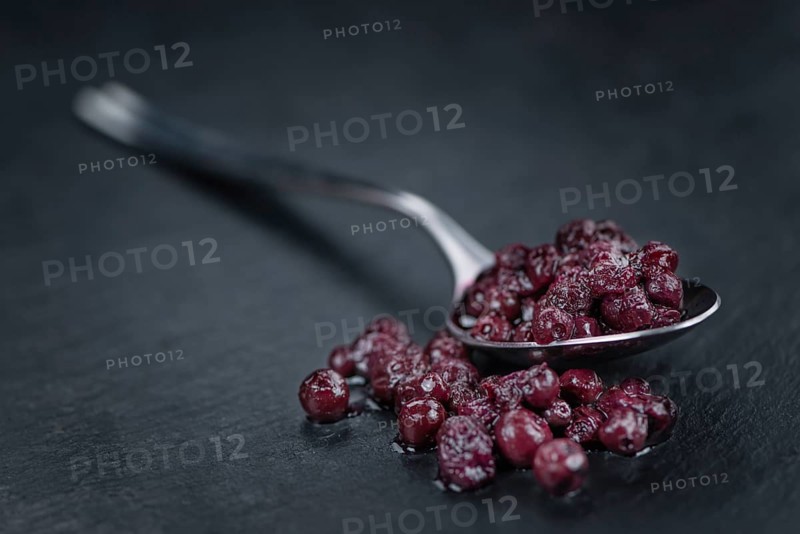 Canned Blueberries on a vintage slate slab as detailed close-up shot, selective focus