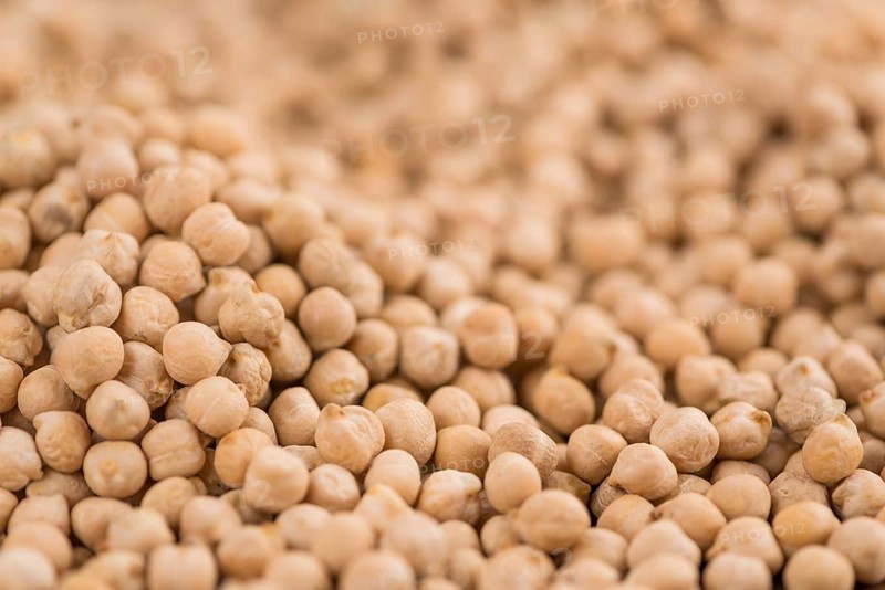 Chickpeas on a vintage background as detailed close-up shot, selective focus