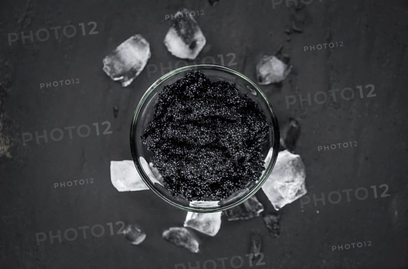 Caviar on a vintage looking slate slab (selective focus)