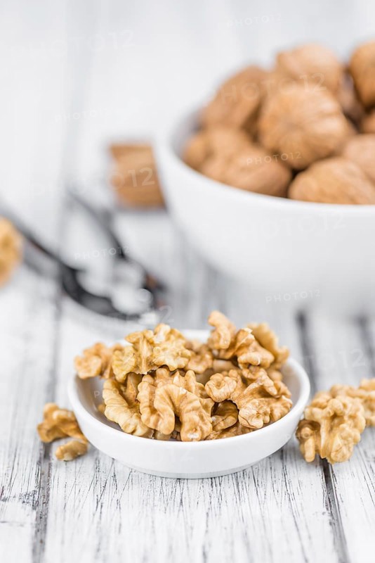 Portion of fresh Walnut kernels (close-up shot, selective focus)