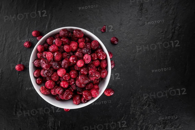 Portion of healthy Dried Cranberries (selective focus, close-up shot)