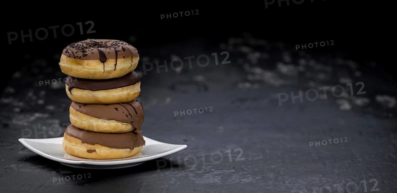 Portion of some Donuts as detailed close-up shot (fresh made, selective focus)