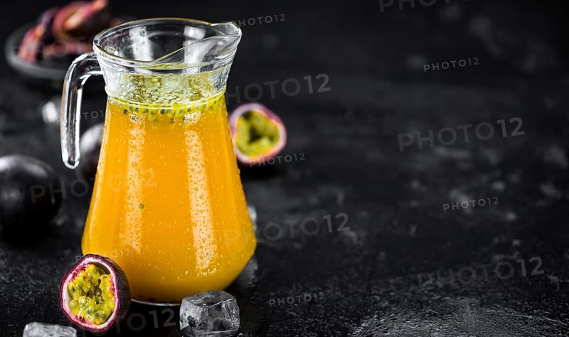 Maracuja Juice on a vintage looking slate slab (selective focus)