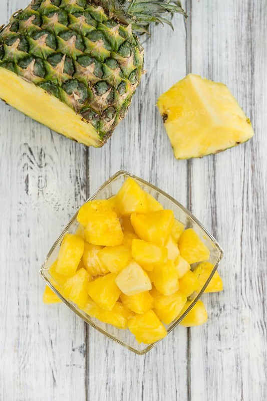 Fresh made Pineapple (sliced) on a vintage background as detailed close-up shot