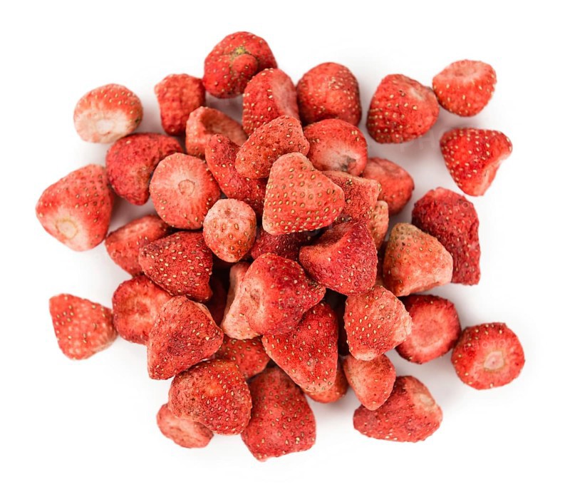Portion of Dried Strawberries as detailed close-up shot isolated on white background
