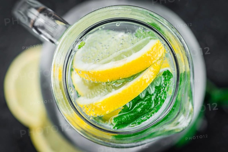Portion of Lemonade as detailed close up shot on a slate slab (selective focus)