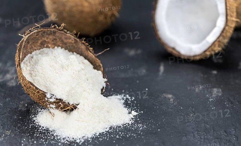 Some fresh made Coconut flour on a vintage slate slab (selective focus)
