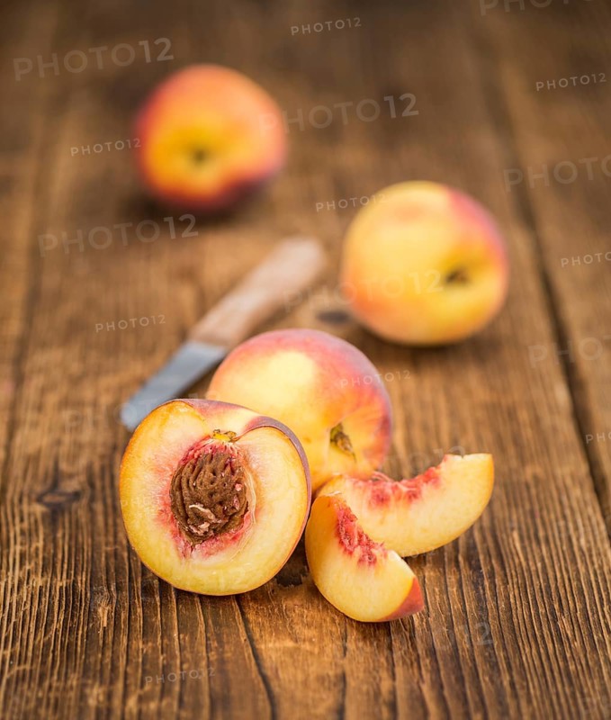 Peaches on a vintage background as detailed close-up shot, selective focus