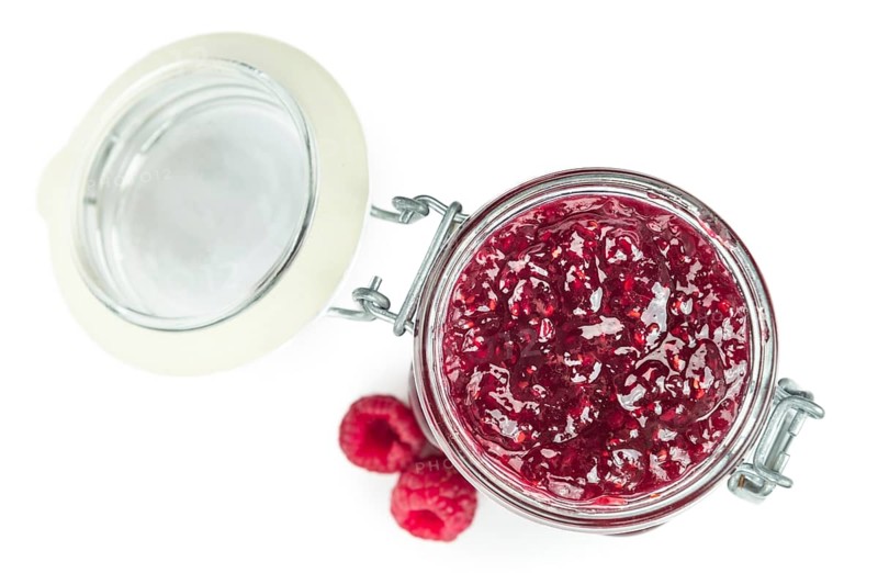 Raspberry Jam isolated on white background, selective focus, close-up shot