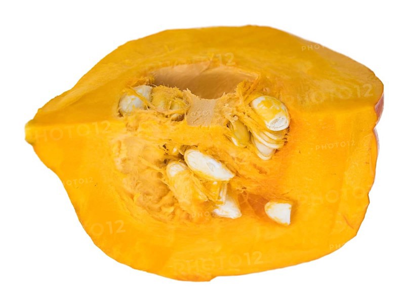 Portion of fesh Pumpkin (close-up shot) isolated on a white background