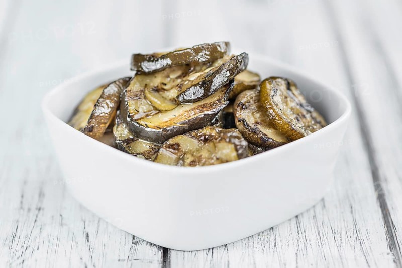Homemade Antipasti (Grilled Zucchinis) on vintage background (selective focus, close-up shot)