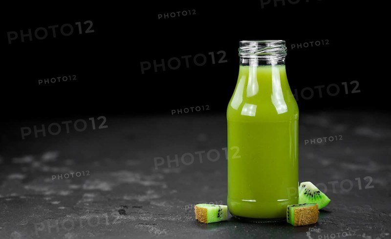 Fresh made Kiwi Smoothie (selective focus) on a vintage looking background