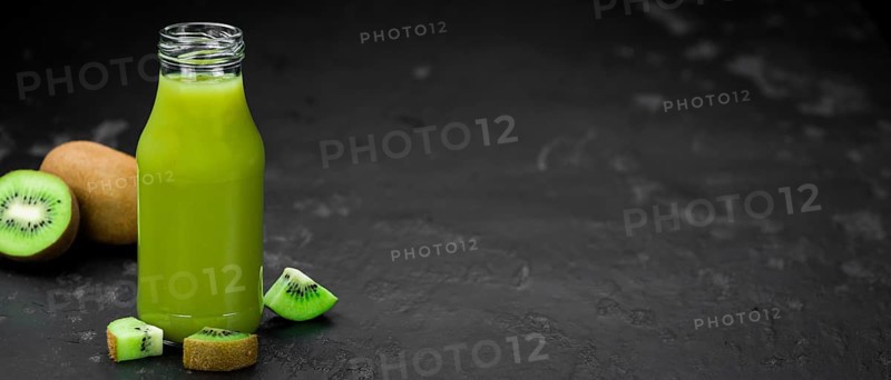 Fresh made Kiwi Smoothie (selective focus) on a vintage looking background
