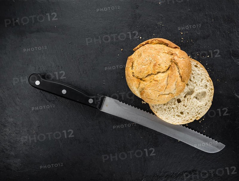 Portion of German Buns on a rustic slate slab, selective focus, close-up shot