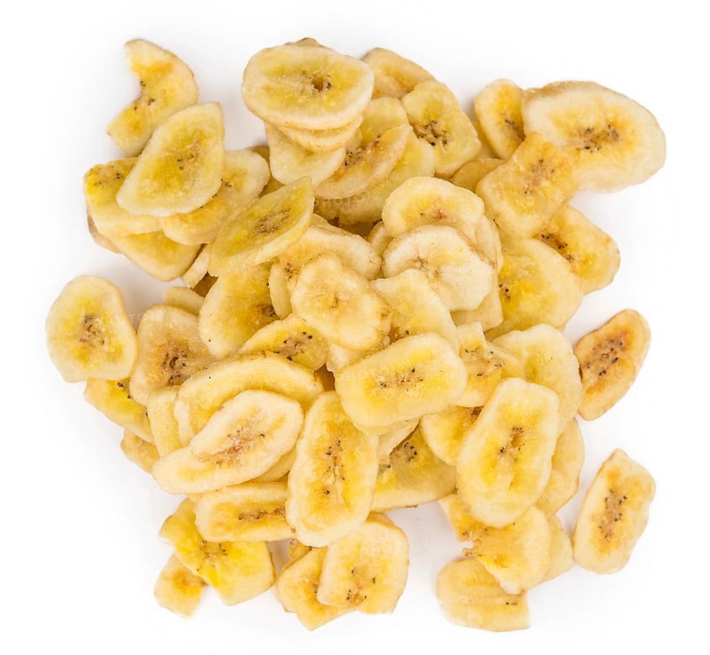 Dried Banana Chips isolated on white background, selective focus, close-up shot
