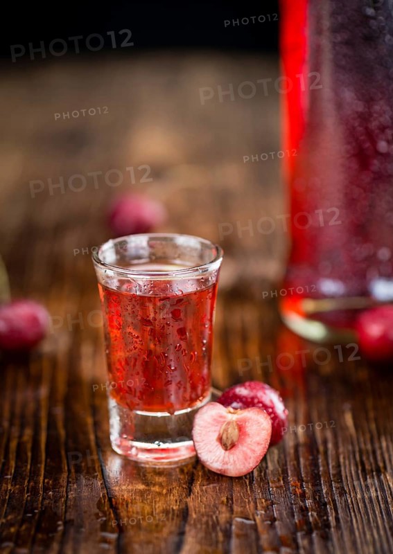 Some homemade Cherry Liqueur as detailed close-up shot, selective focus
