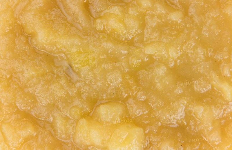 Homemade Applesauce (selective focus, close-up shot) on vintage background with some fresh fruits