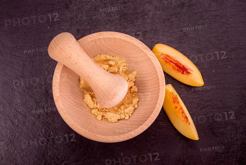 Portion of fresh Ground Peaches close-up shot, selective focus