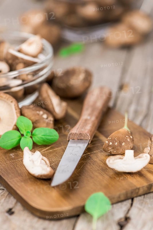 Portion of fresh Shiitake mushrooms close-up shot, selective focus