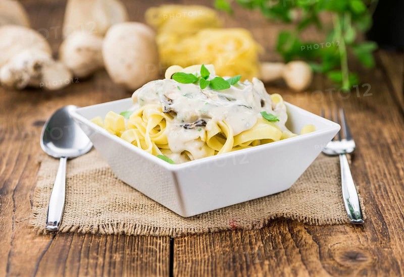 Homemade Porcini pasta on vintage background selective focus, close-up shot