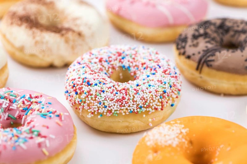 Portion of some Donuts as detailed close-up shot (fresh made, selective focus)