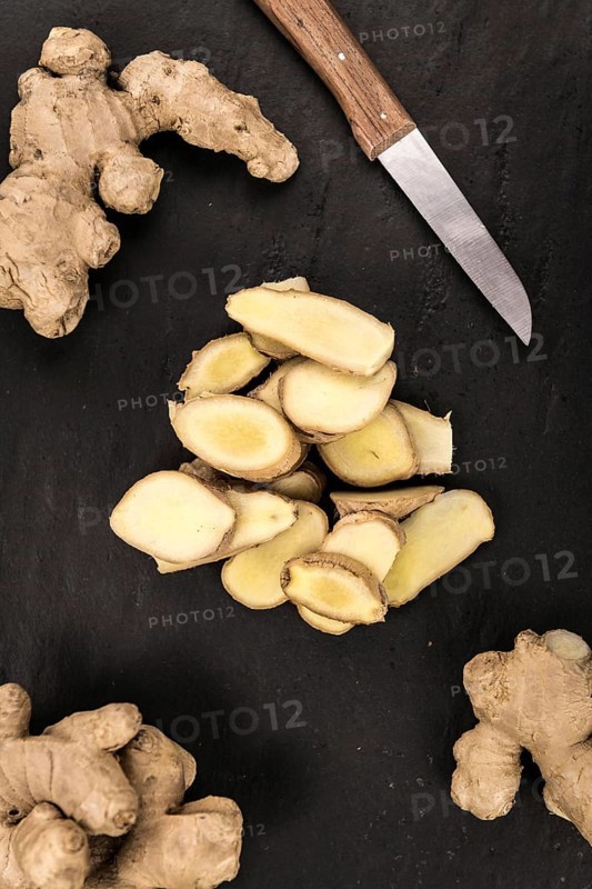 Slate slab with Ginger Slices (selective focus, close-up shot)