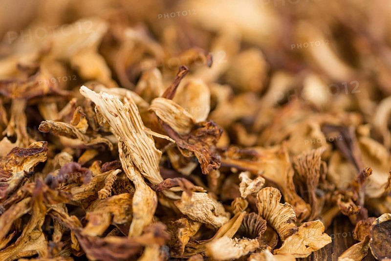 Fresh made Dried Chanterelles on a vintage background as detailed close-up shot