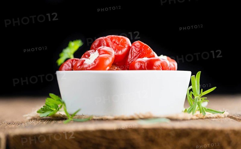 Homemade Filled Pimientos on vintage background (selective focus, close-up shot)