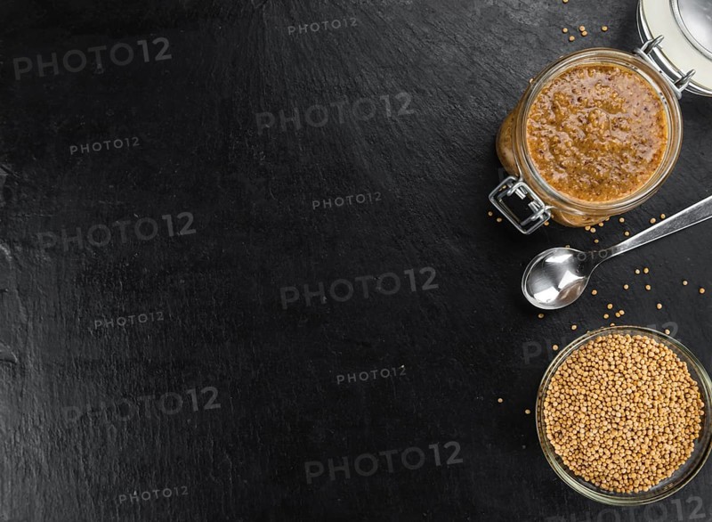 Sweet Mustard on a vintage background as detailed close-up shot (selective focus)