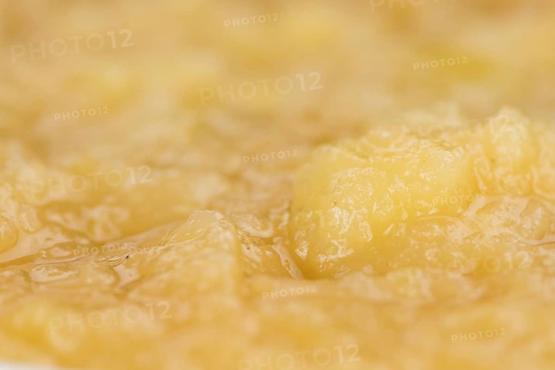 Portion of homemade Applesauce (selective focus, close-up shot) on vintage background