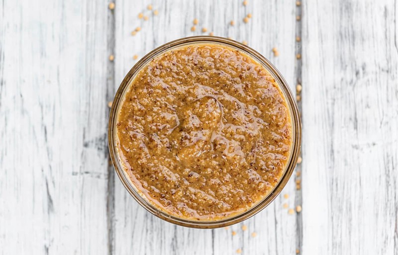 Sweet Mustard on a vintage background as detailed close-up shot (selective focus)