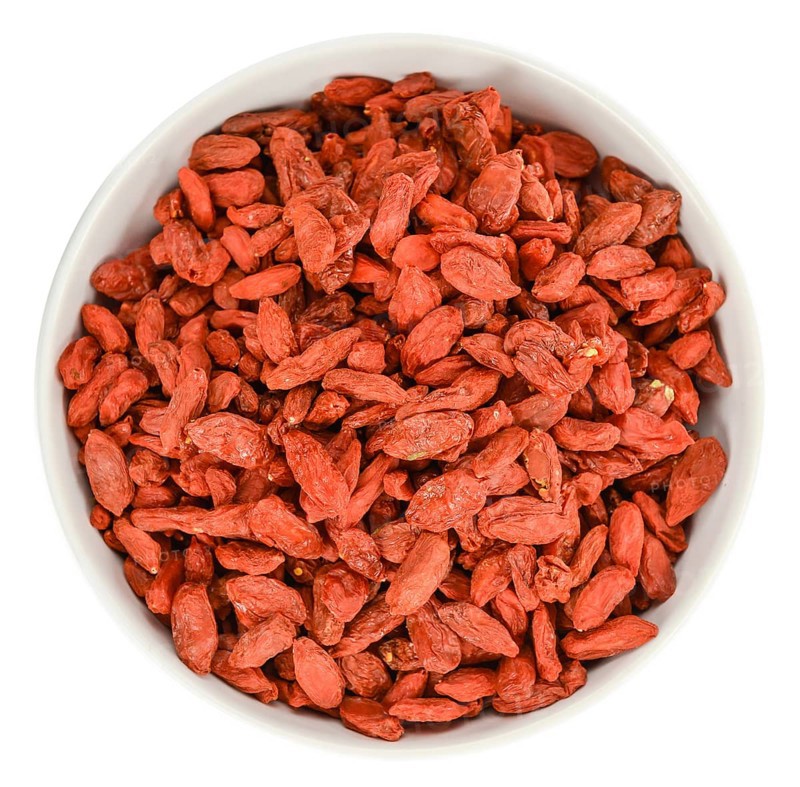 Goji Berries (dried) isolated on white background (selective focus, close-up shot)