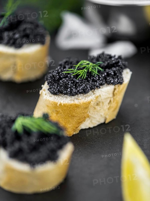 Caviar on a vintage looking slate slab (selective focus)