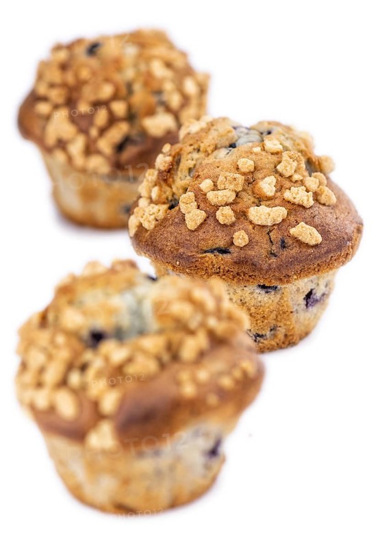 Blueberry Muffins isolated on white background (selective focus, close-up shot)