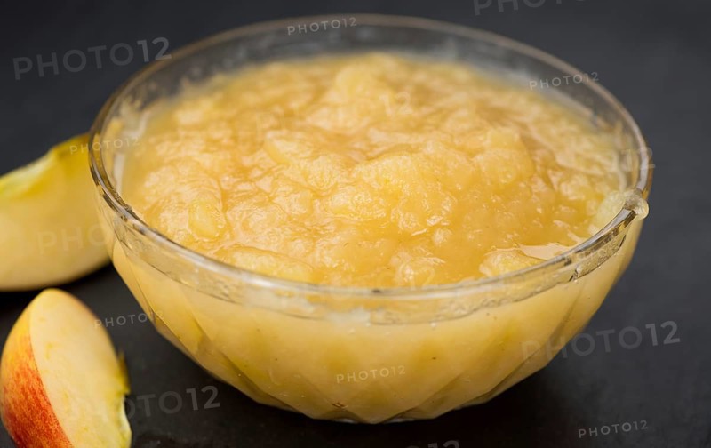 Homemade Applesauce (selective focus, close-up shot) on vintage background with some fresh fruits