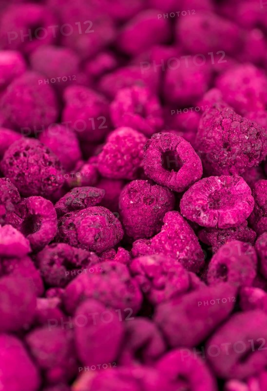 Some homemade Raspberries (dried) as detailed close-up shot, selective focus