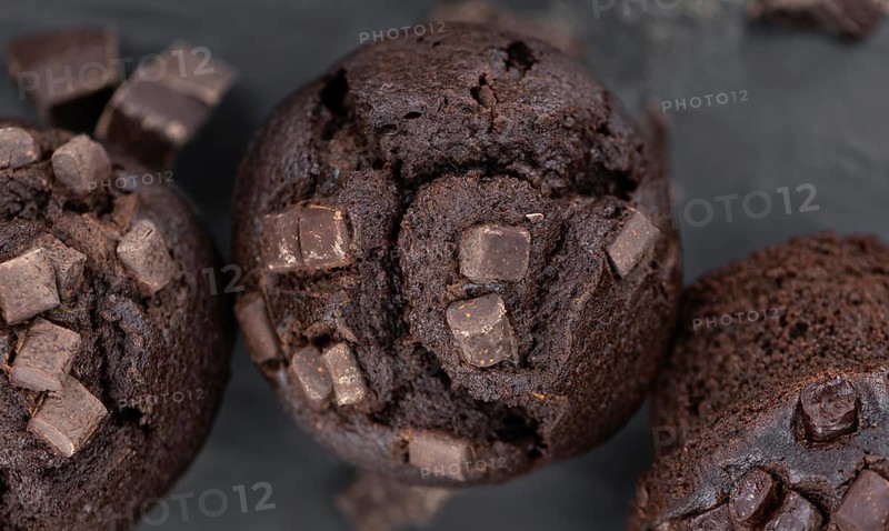 Fresh Chocolate Muffins as detailed close-up shot (selective focus)
