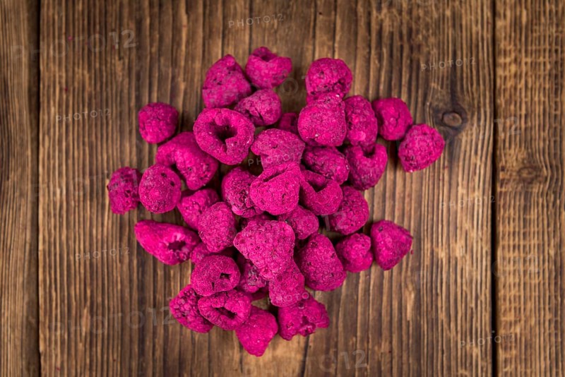 Some homemade Raspberries (dried) as detailed close-up shot, selective focus