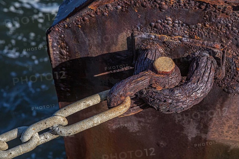 Rusted anchor pin along the Pensacola Bay seawall at the Vince Whibbs Sr. Community Maritime Park (CMP) in downtown Pensacola, Florida
