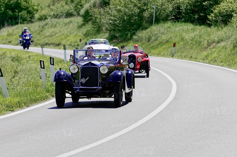 Blue vintage racing car leads a group of classic cars on a winding country road, classic car, car racing, Mille Miglia, 1000 Miglia, 2015, Tuscany, Rome Lake Garda, Italy, Europe