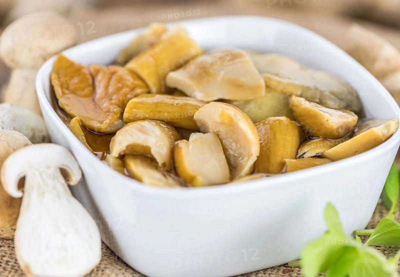 Homemade Canned Porcinis on vintage background selective focus, close-up shot
