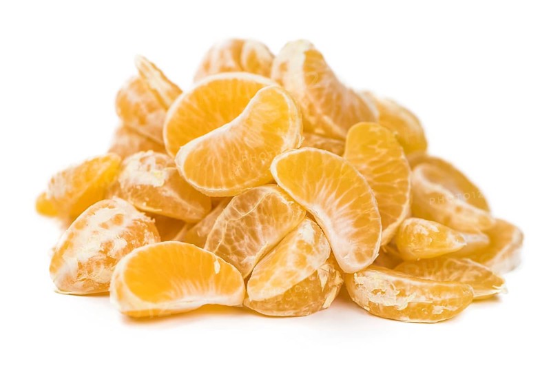 Portion of tangerines (close-up shot, selective focus) isolated on white background