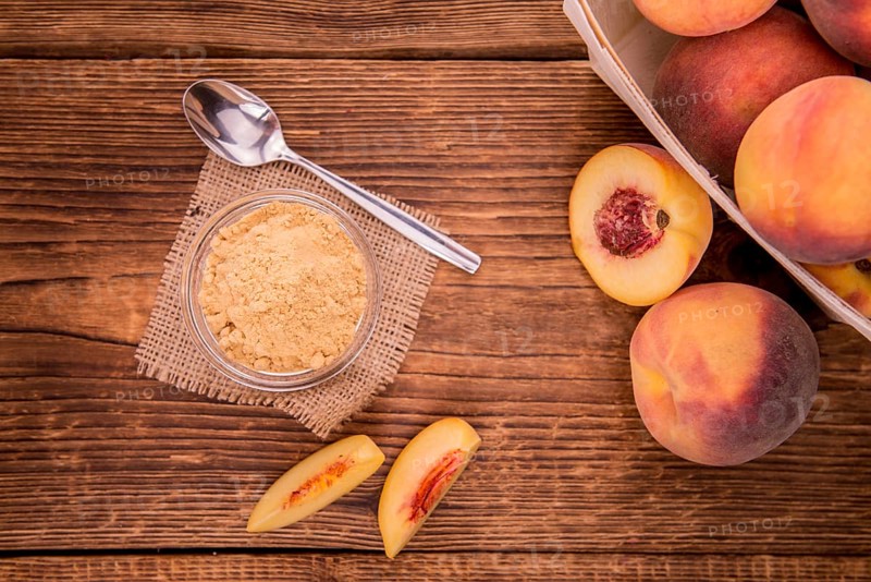 Ground Peaches on a vintage background as detailed close-up shot, selective focus