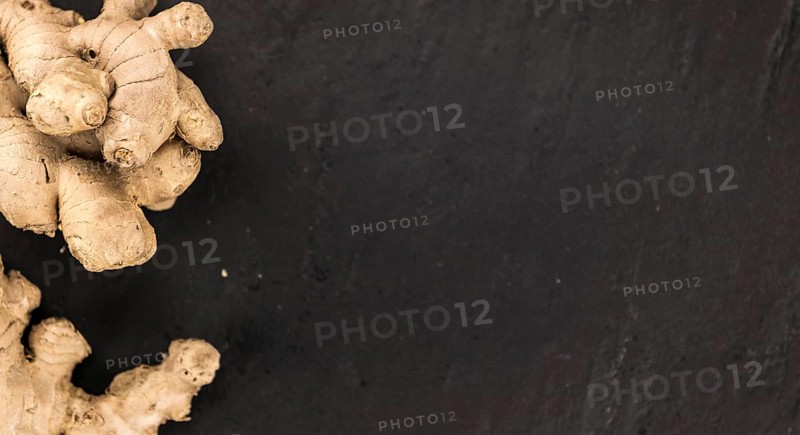 Slate slab with Ginger Slices (selective focus, close-up shot)