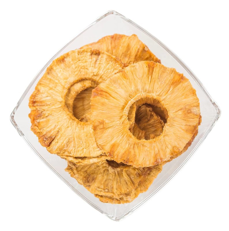 Fresh made Dried Pineapple Rings isolated on white background, close-up shot